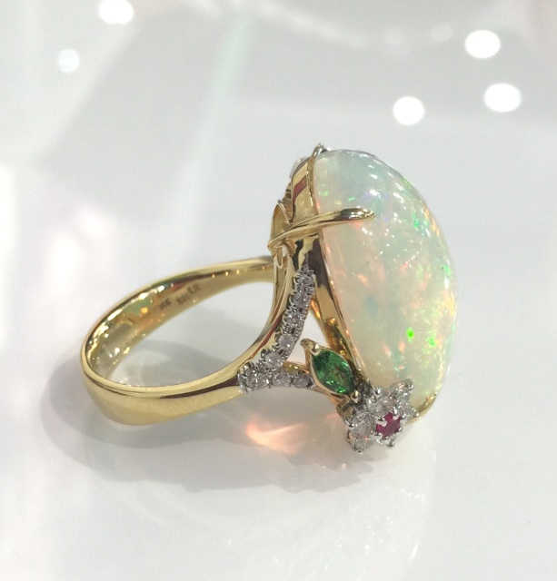 Stunning Ethiopian opal ring set with diamond flowers